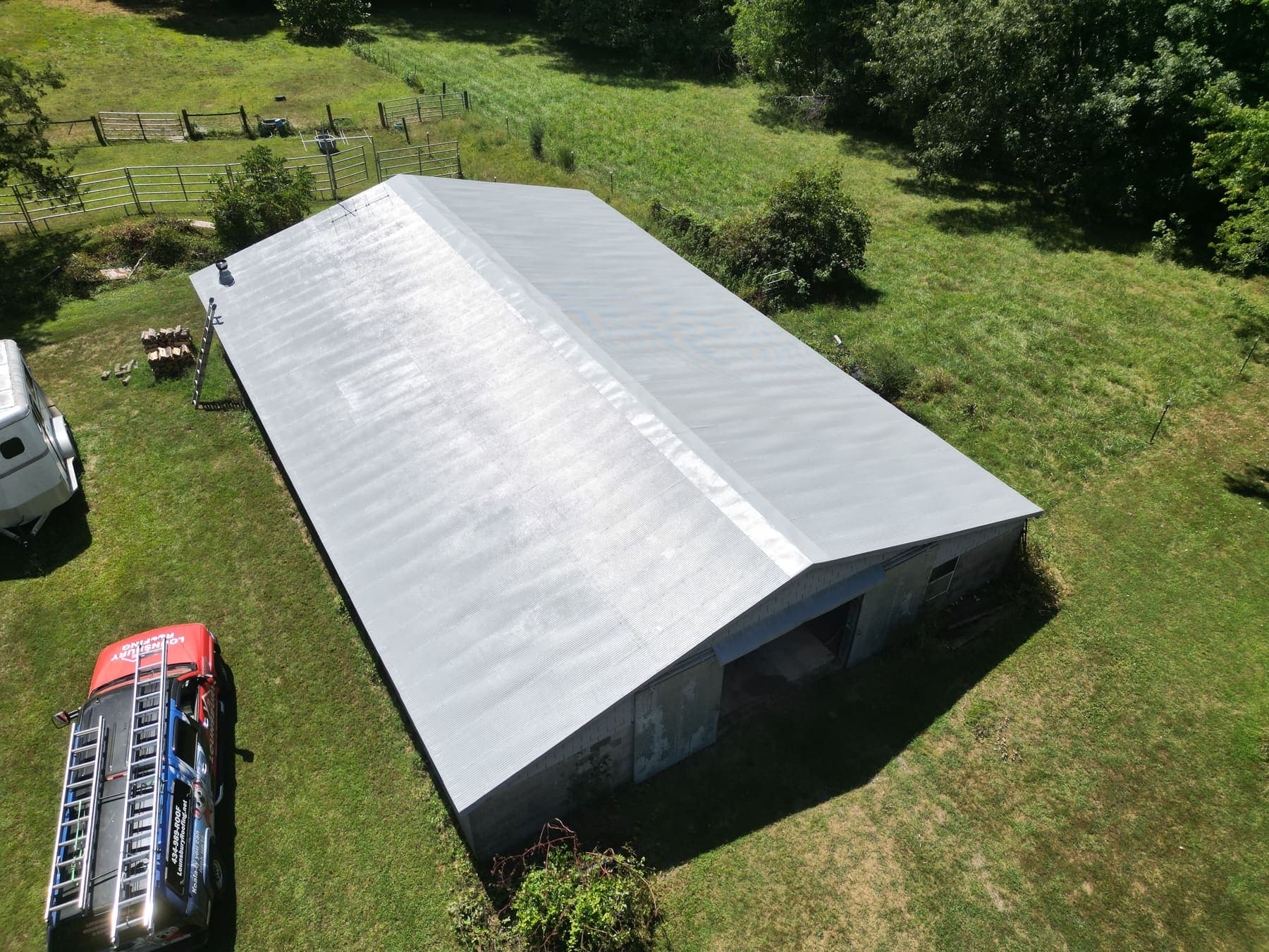 Aerial of a recoated metal barn roof in central Virginia