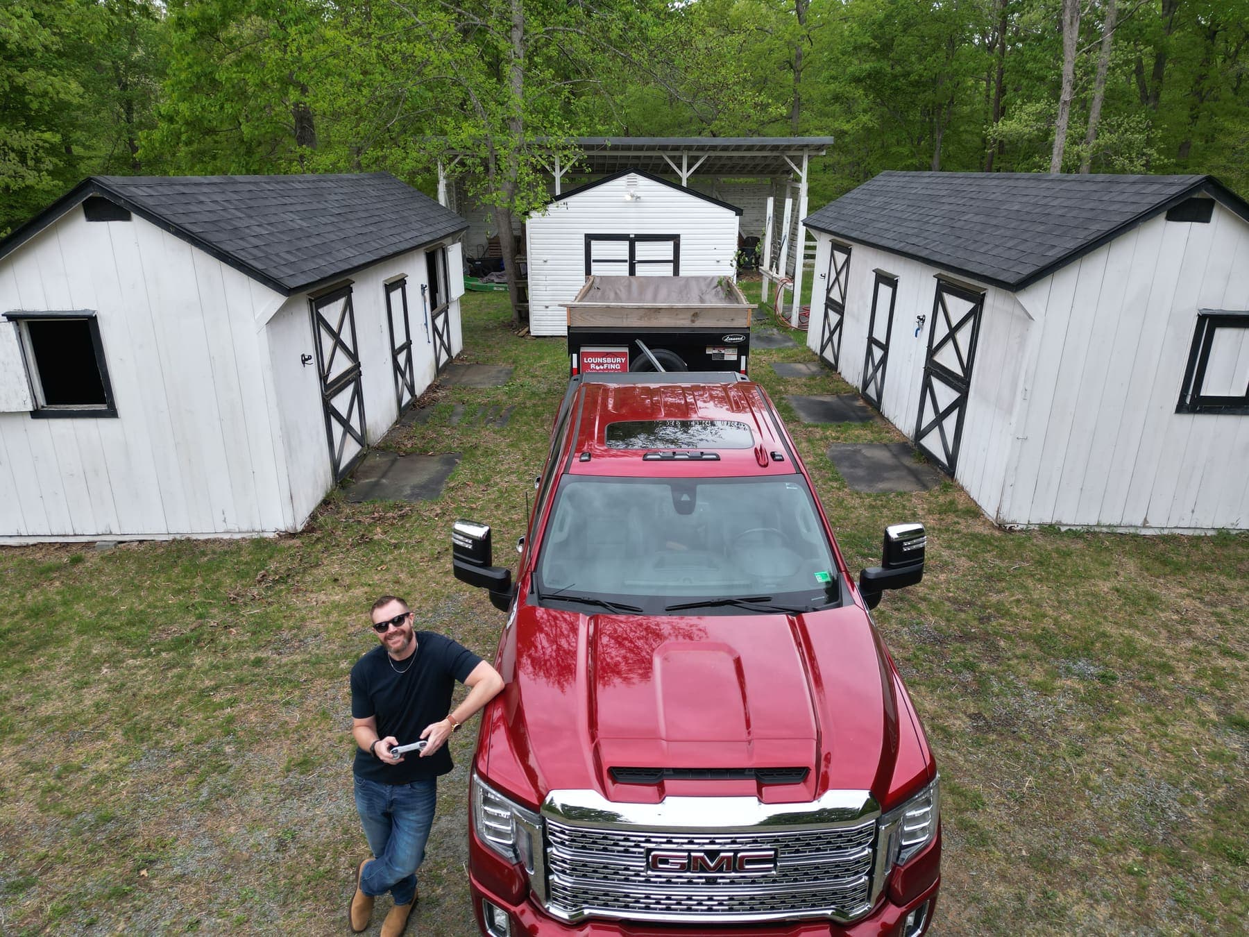 Lounsbury Roofing's red truck and gear at the Palmyra, VA headquarters on Broken Island Road